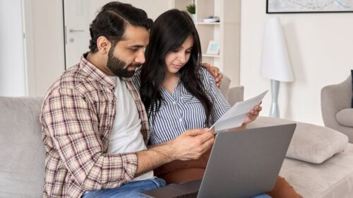 couple reading paper